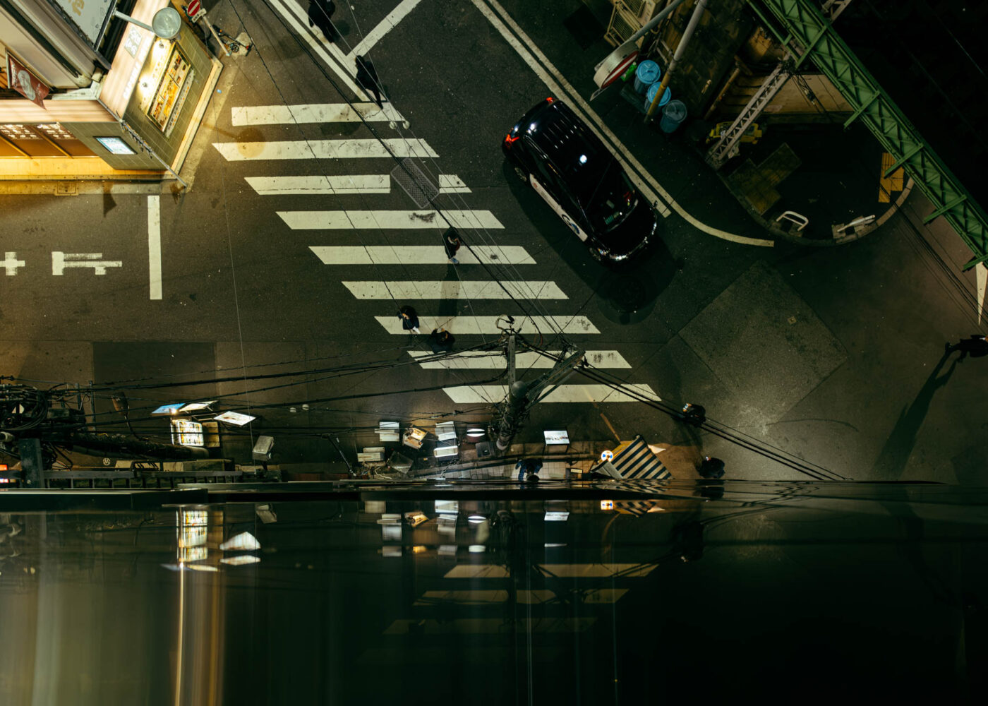 crosswalk reflection by robert mangelmann | 20231129tokyo_304